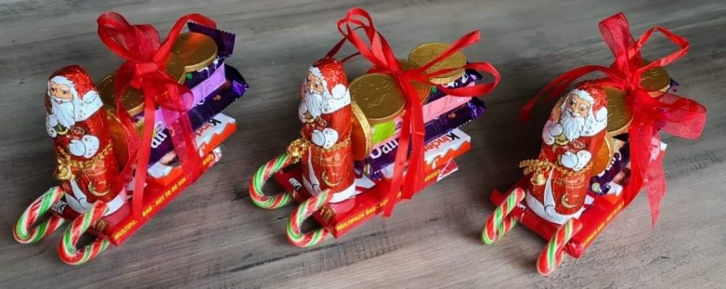 A photo of a chocolate and sweet santa sleigh gift